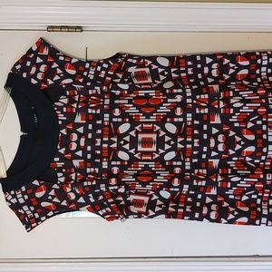 Dress orange and black design. Lined shirt.zip back. Cutouts around neck.